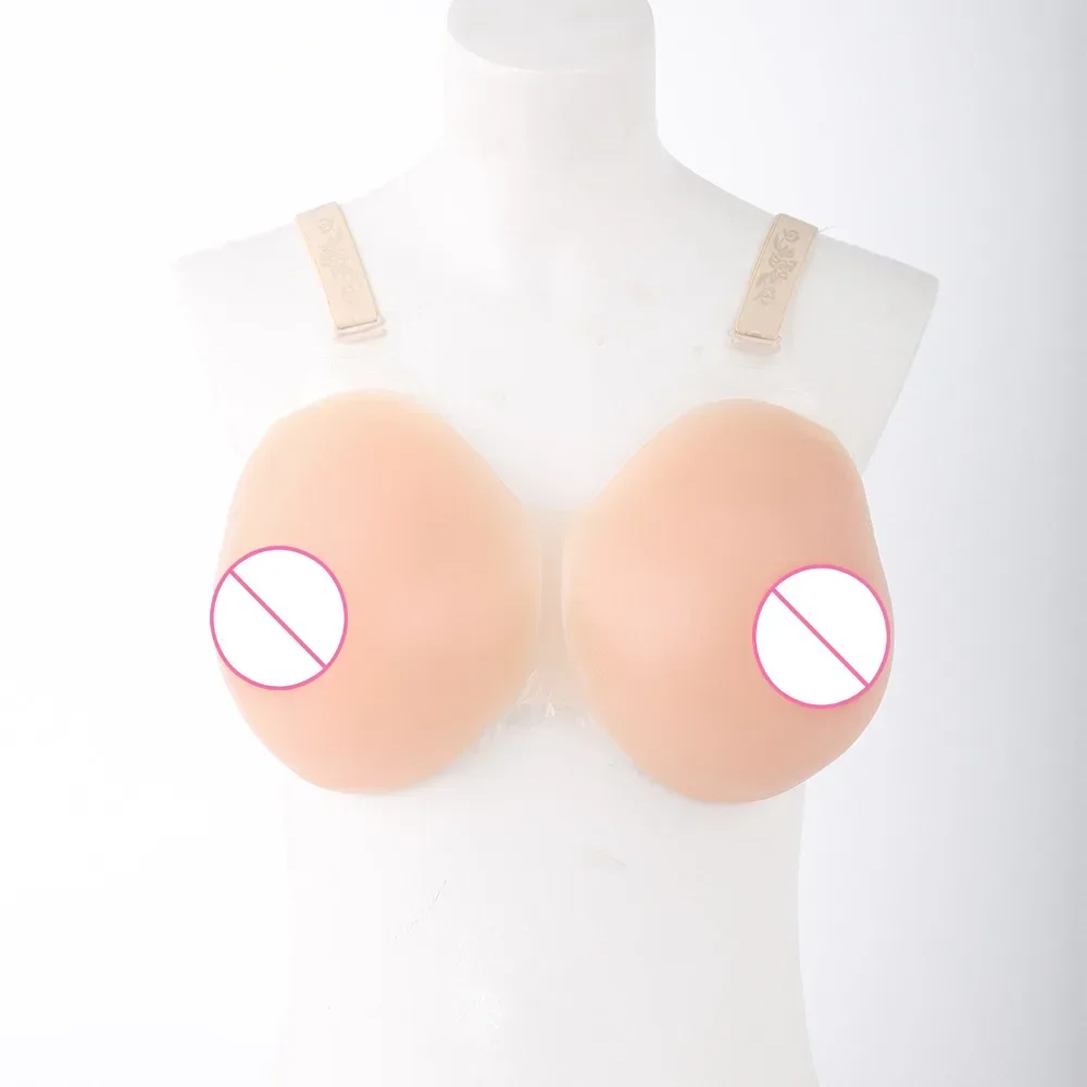 Сопряженные силиконовые грудные протезы, замаскированные под чашечки для увеличения груди на компакт-диске, дополненные вогнутыми и круглыми накладными грудями